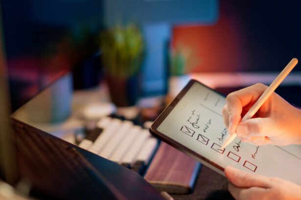 Someone is writing on a tablet with a stylus.